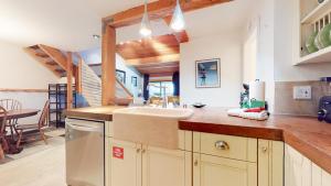 a kitchen with a sink and a dining room at Summit #92 condo in Mammoth Lakes