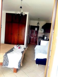 a room with a kitchen and a living room at Appartement hôtel cabo dream in Cabo Negro +8 photos