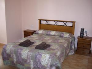 Postel nebo postele na pokoji v ubytování Hostal Abastos