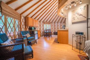 a room with a kitchen and a living room at Strawhouse Resorts in Big Bar +83 photos