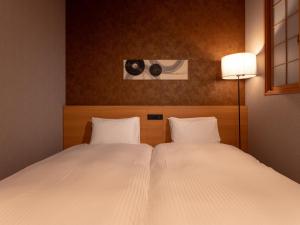 Letto o letti in una camera di MIMARU SUITES Tokyo Asakusa