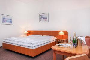 Letto o letti in una camera di Hotel Astra