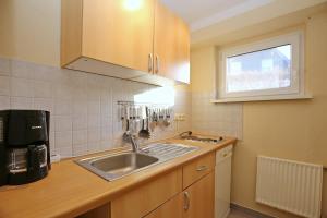 Kuchyň nebo kuchyňský kout v ubytování Friedrich-Engels-Straße Janka + 9 fotografií