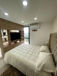 Cama o camas de una habitación en Hermoso e iluminado Apartamento