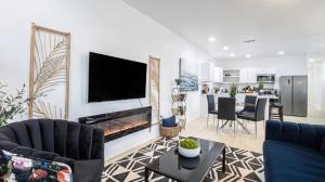 a living room with a fireplace with a tv at Vibrant Blue Luxury Loft 2316 in New Orleans