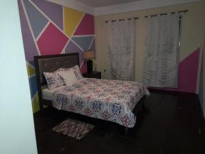 Ένα ή περισσότερα κρεβάτια σε δωμάτιο στο Tropical Suites