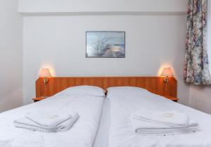 Letto o letti in una camera di Hotel Astra