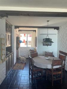 a dining room with a table and chairs and a dog at Casa Nostrum Priceless View Central Location 3BR 3BA in Punta del Este
