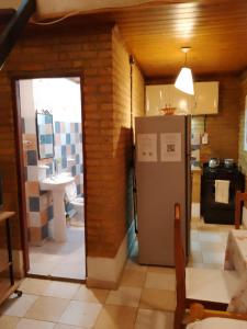 a kitchen with a refrigerator and a sink at DEPARTAMENtO LOFT in Posadas