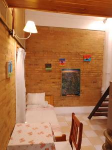 a room with two beds and a staircase in it at DEPARTAMENtO LOFT in Posadas