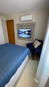 Säng eller sängar i ett rum på Apartamento altíssimo padrão - Piscina com vista