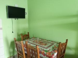 a dining room with a table with a candle on it at SF-deptos in Federación