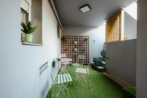 A seating area at Le Petit Jardin #2