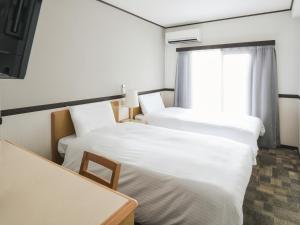 东京浅草筑波快速船舶酒店(Vessel Inn Asakusa Tsukuba Express)房間的床