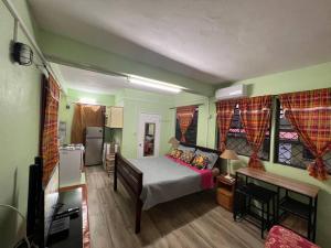 Łóżko lub łóżka w pokoju w obiekcie Homely Environment Studio Apt