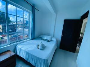 Letto o letti in una camera di Apartamentos Sweet Island