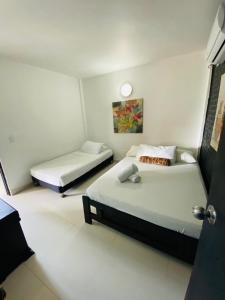 Letto o letti in una camera di Apartamentos Sweet Island
