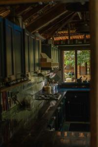 a kitchen with a stove and a counter top at Turia Villa Canacona Palolem in Canacona