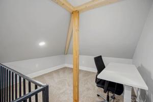 a desk and a chair in a room at Chevy Chase 4 BR 2 offices Comfortable Inviting in Washington