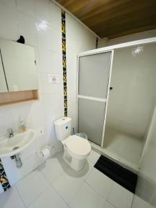 a bathroom with a toilet and a shower and a sink at Apartamentos Sweet Island in San Andrés