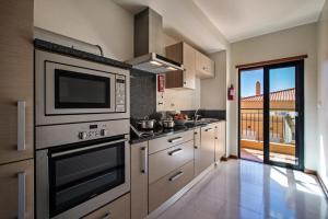 Dapur atau dapur kecil di Baia da Luz Resort
