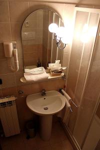 Koupelna v ubytování Dominus Hotel