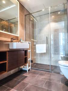 a bathroom with a sink and a shower at STAY BY LATINEM Luxury 1BR Holiday Home G6524 near Burj Khalifa in Dubai