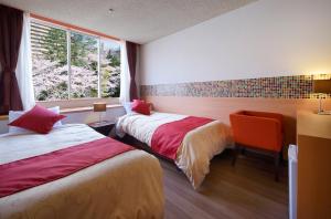 Postel nebo postele na pokoji v ubytování Hotel Seiryu Japanese Spa inn with spectacular view in Osaka + 115 fotografií