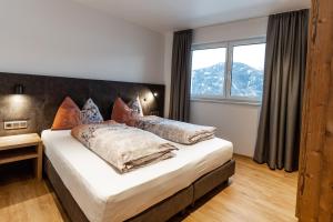 A bed or beds in a room at Luxapart Haus 2 Még 37 kép
