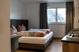 A bed or beds in a room at Luxapart Haus 2
