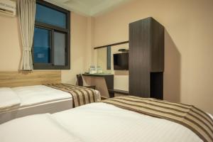 Postel nebo postele na pokoji v ubytování Shan Shui Hostel + 37 fotografií