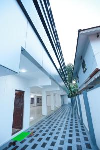 a view of the hallway of a building at Kausthubhom Residency in Tiruvalla