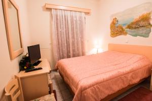 Postel nebo postele na pokoji v ubytování Artemis