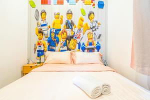 D'Pristine Theme Suite by Nest Home at LEGOLAND客房内的一张或多张床位
