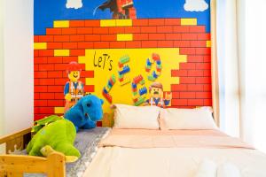 D'Pristine Theme Suite by Nest Home at LEGOLAND客房内的一张或多张床位