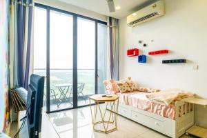 D'Pristine Theme Suite by Nest Home at LEGOLAND客房内的一张或多张床位