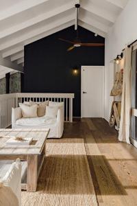 a living room with a white couch and a table at The Mariner in Metung