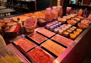 a buffet line with many different types of food at Campanile Melun Sud - Dammarie les Lys in Melun