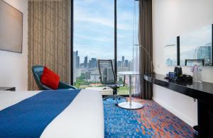 Ένα ή περισσότερα κρεβάτια σε δωμάτιο στο Holiday Inn Express Bangkok Siam by IHG +68 φωτογραφίες