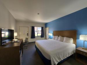 Postel nebo postele na pokoji v ubytování Yogo Inn + 16 fotografií