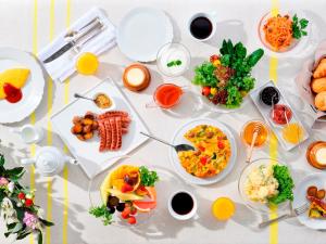 a table with many plates of food on it at Hotel Intergate Tokyo Kyobashi in Tokyo