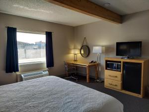 TV a/nebo společenská místnost v ubytování Yogo Inn