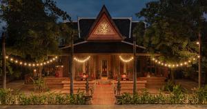 a house with lights in front of it at night at Angkor Village Hotel in Siem Reap