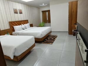 Posteľ alebo postele v izbe v ubytovaní Hotel Lotus