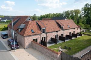 an aerial view of a house with red roofs at Bed and Breakfast Paellepelhoeve in Ninove