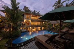 Bazén v ubytování Gynandha Ubud Cottage nebo v jeho okolí