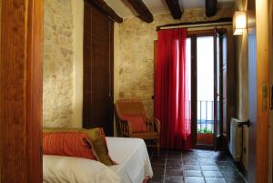 Postel nebo postele na pokoji v ubytování Cal Porxo del Priorat + 17 fotografií