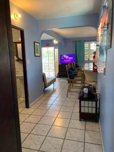 a hallway with a living room and a dining room at Esperanza Inn Guesthouse in Vieques