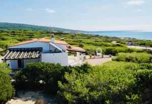 a white house with a view of the ocean at Casa Stefi - Astbury Formentera in Es Arenals