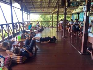 a group of people laying on the floor of a building at OK2 Mamajim Bungalows in Ko Tao